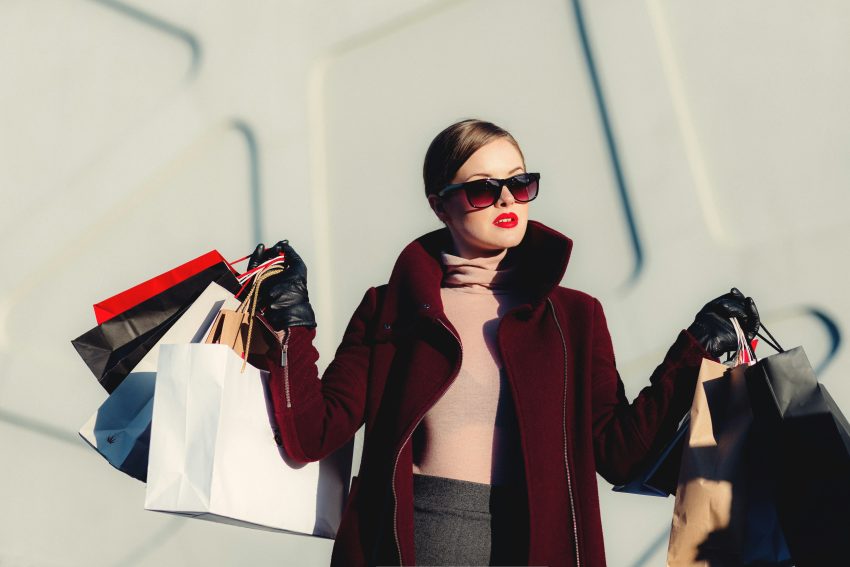 A woman with the choice of using Afterpay vs Klarna for shopping.