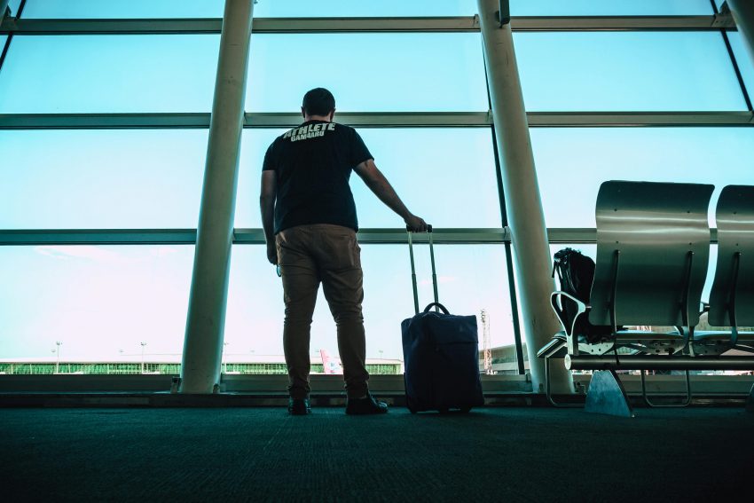 A man waiting to be boarded on his flight afforded from beyond Black Friday deals.